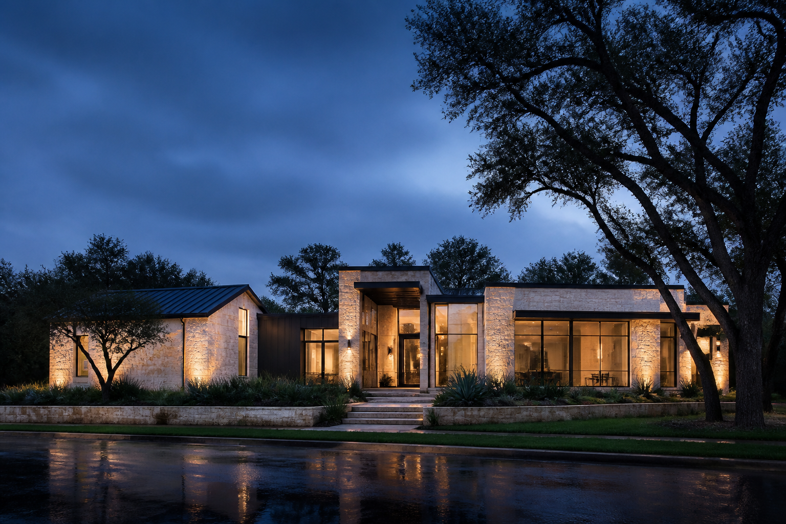 Concept image of a pale limestone Austin home glowing after rain at blue hour